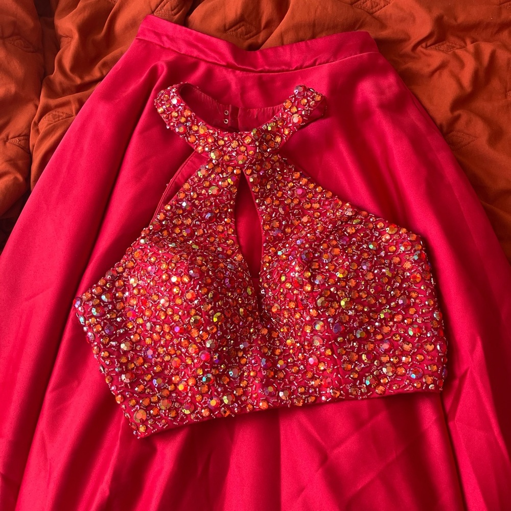 beautiful red sequined 2-piece prom dress features bedazzled top and full skirt